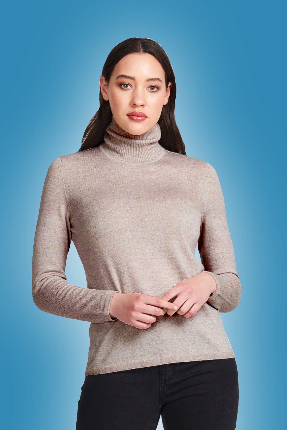 Woman wearing the Classic Merino Polo in Light Sand by Royal Merino against a blue background