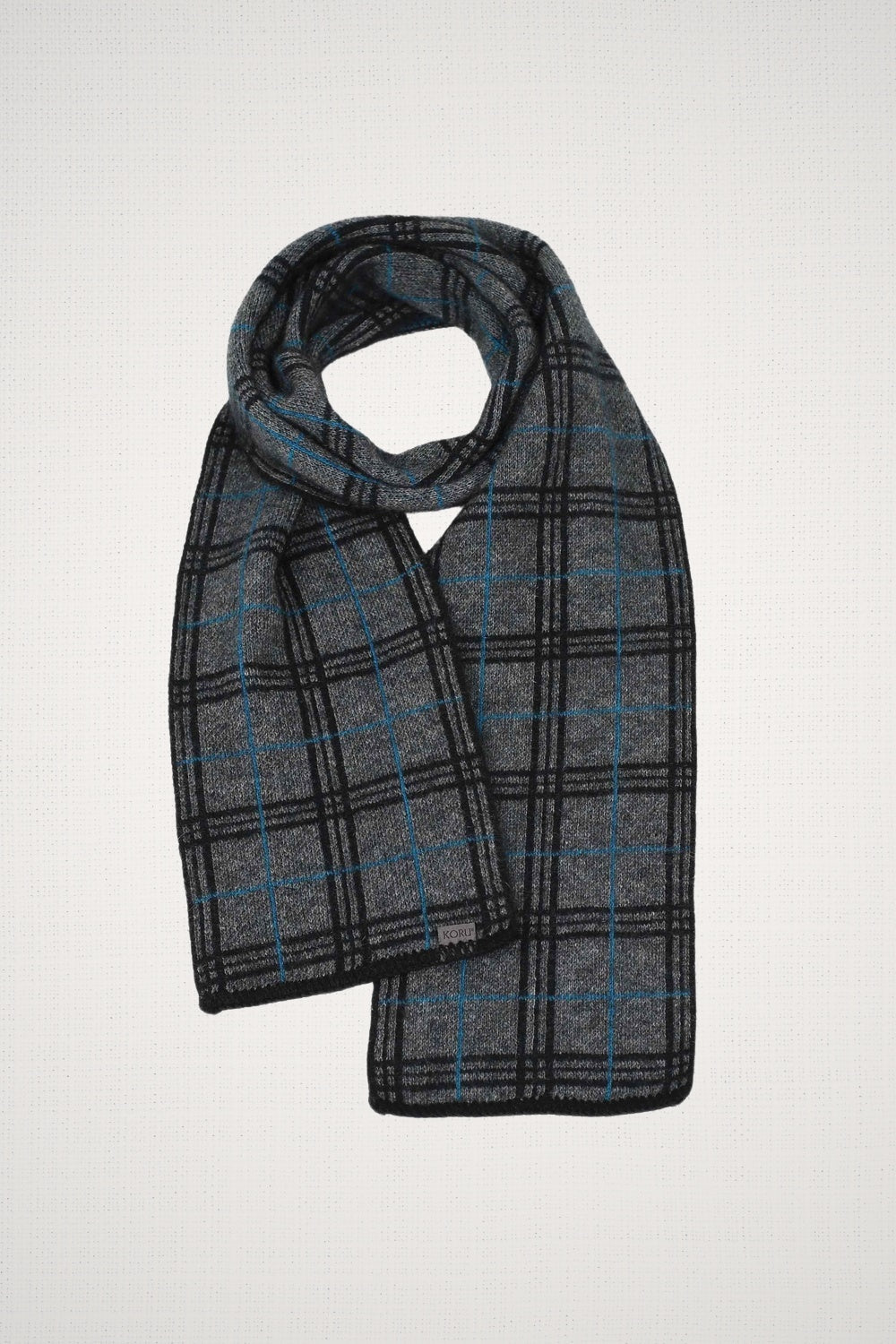Tartan Possum Merino Scarf in Grey/Black/Pacific by Koru on a white background