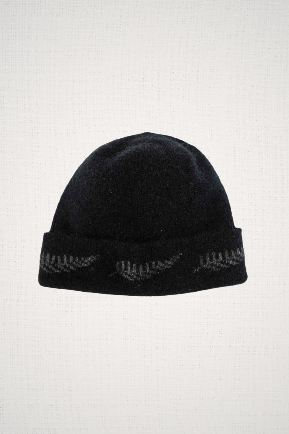 Fern Possum Merino Beanie in Black/Grey by Koru on a white background