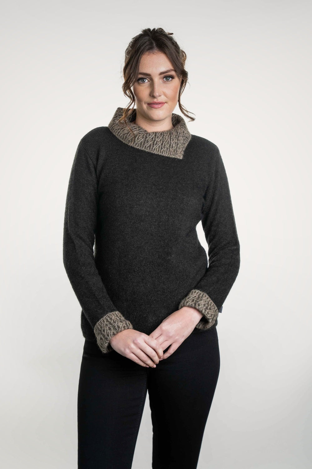 Woman wearing the Two Tone Possum Merino Jumper in Espresso/Mocha by Koru against a white background