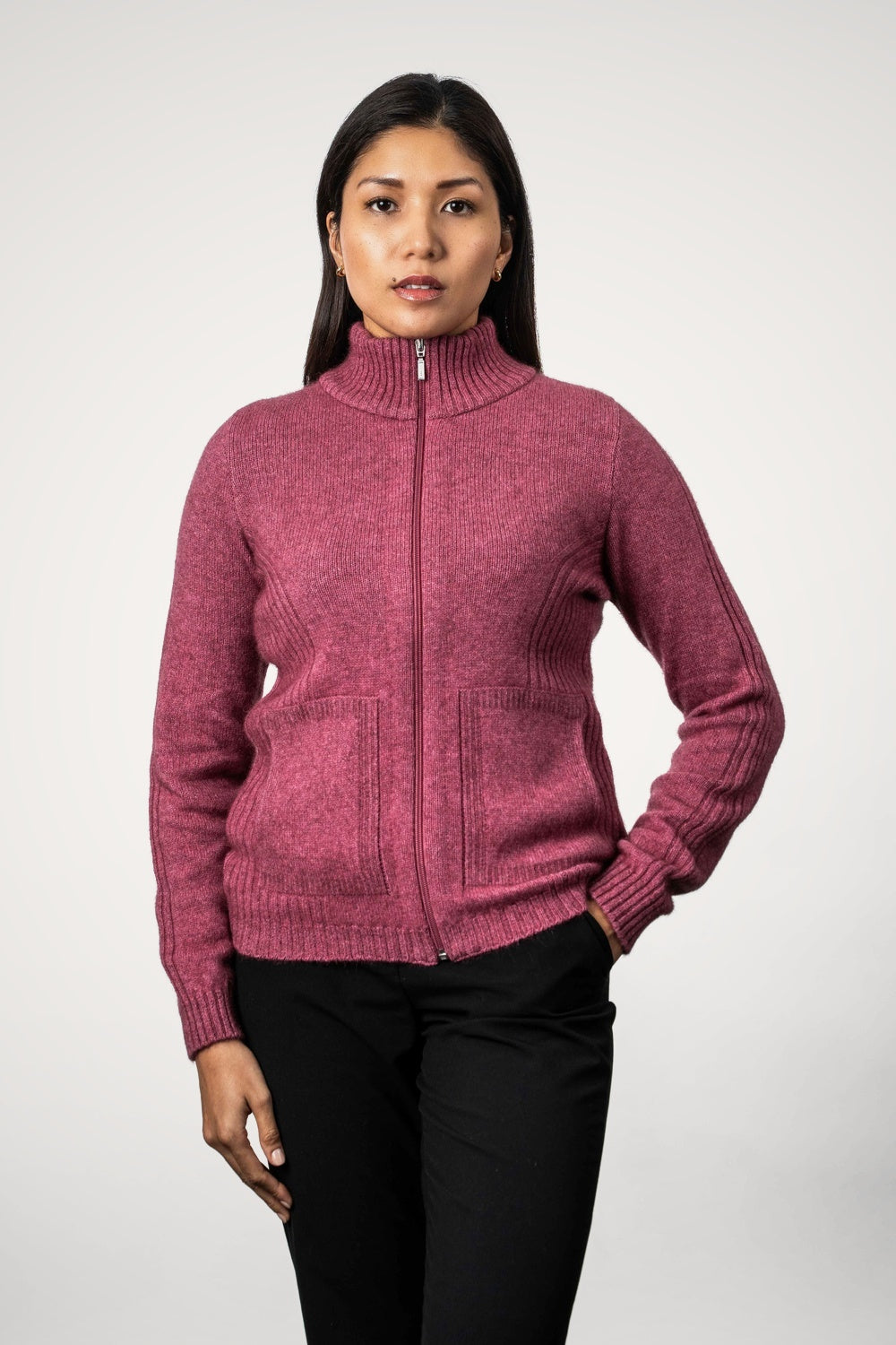 Woman wearing the Rib Detail Possum Merino Jacket in Rose by Koru on a white background
