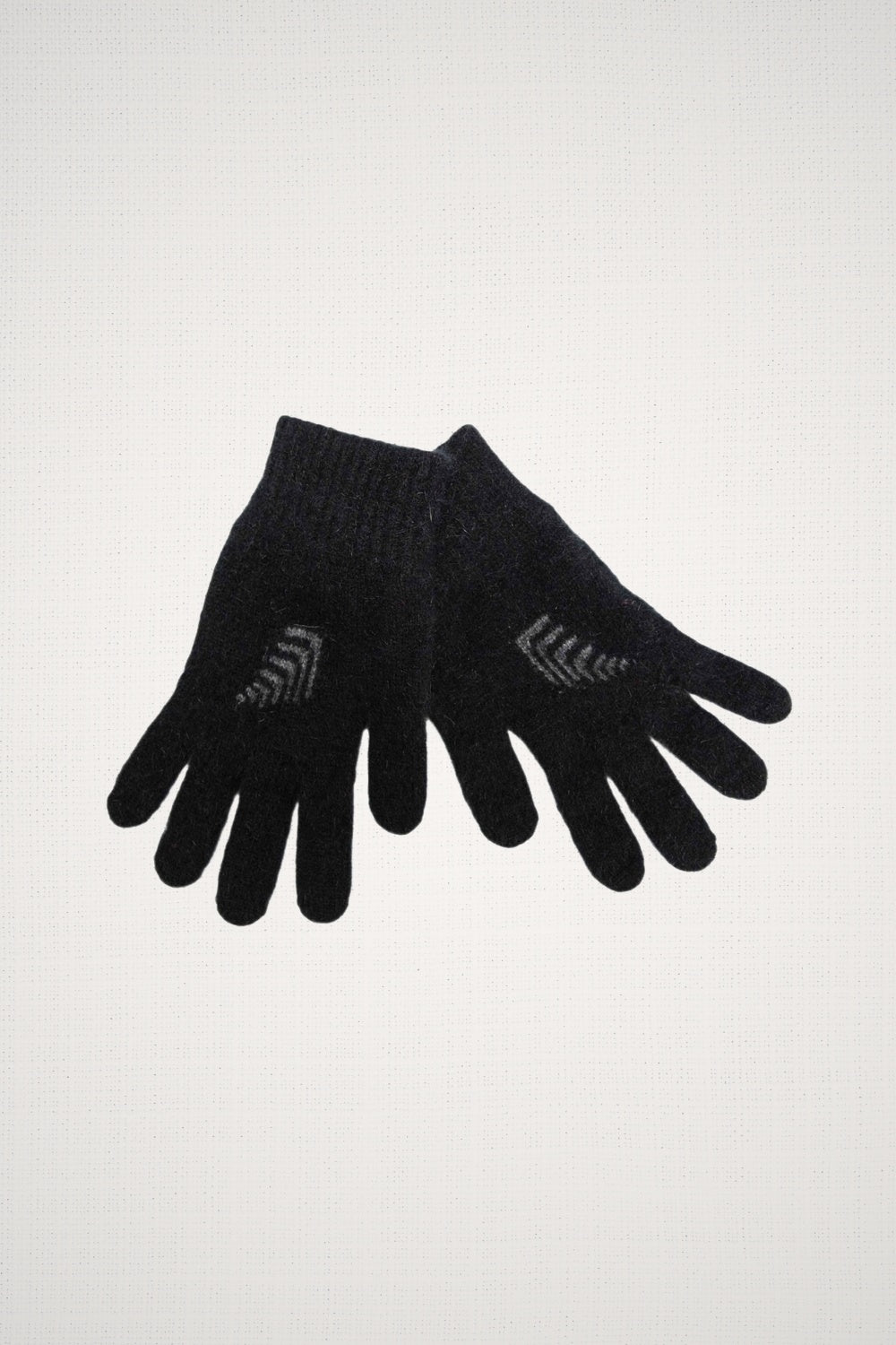 Fern Possum Merino Gloves in Black/Grey by Koru on a white background