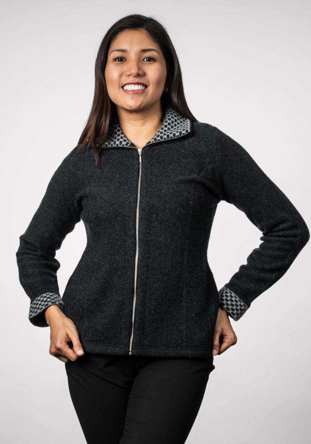 Woman wearing the Contrast Trim Possum Merino Jacket in Black Marl/Mist by Trilogy on a white background
