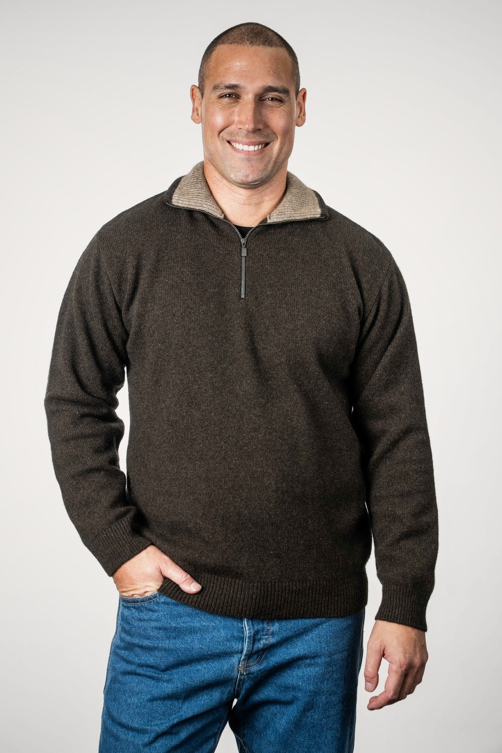 Man wearing Zip Collar Possum Merino Jumper in Cocoa/Mocha by Trilogy against a white background